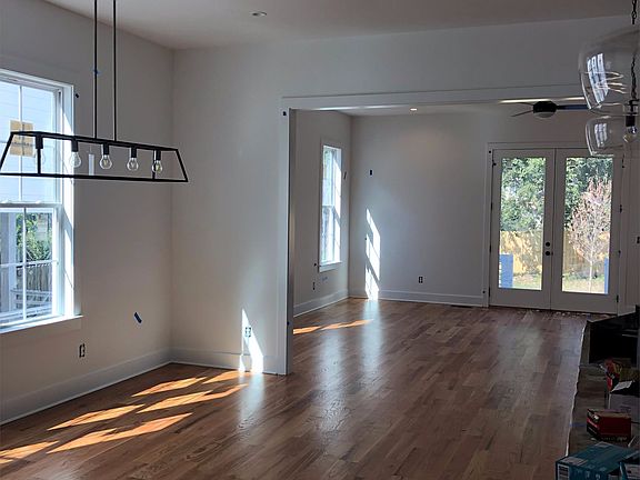 Dining area adjacent to kitchen with island bar.