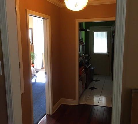 Hallway with a 1950's atomic glass lamp, which is a permanent fixture