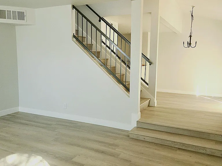 View from living room to the dining area. Beautiful vinyl plank flooring.