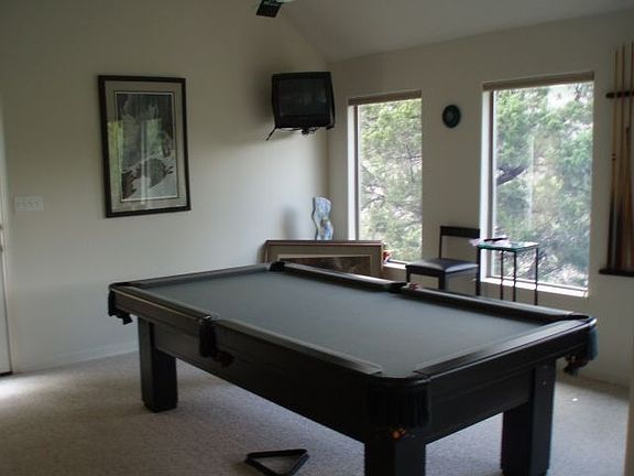 Upstairs living room with views of trees