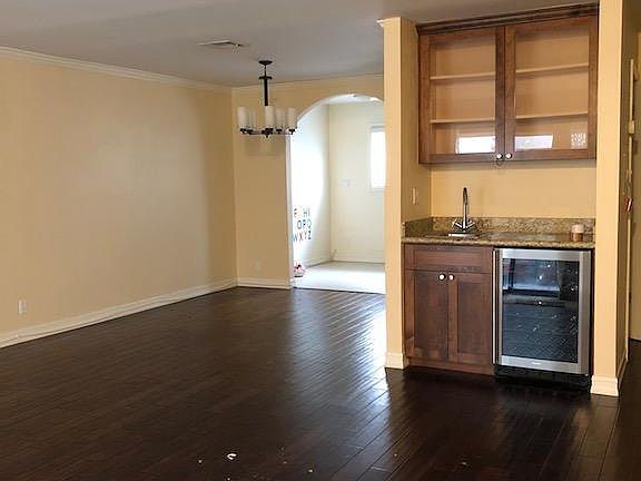 View from main door into the dining room, living room, wet b