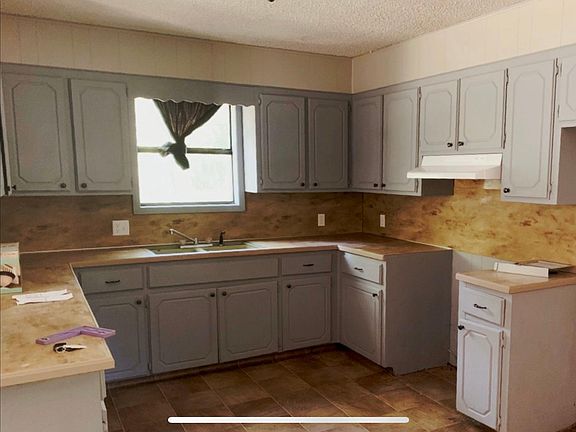 Open concept kitchen with breakfast bar into the living room