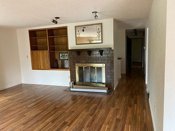Large living room with live fireplace.