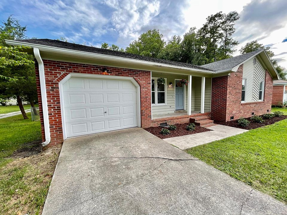 Front of the home features all new landscaping. The one car garage offers plenty of room for additional storage.