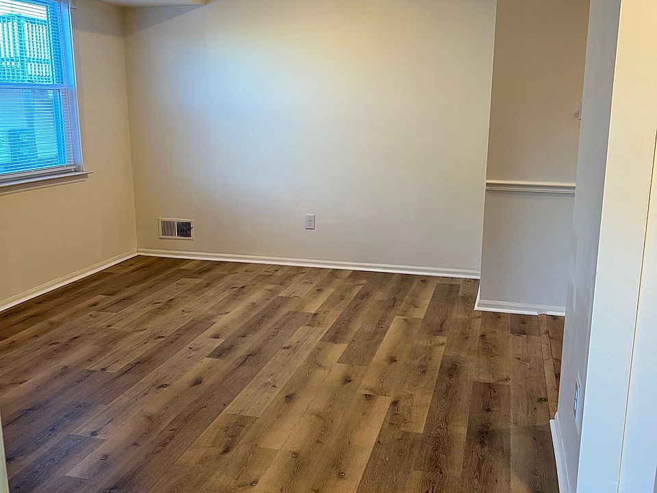 Living Room - all new flooring. Front door located on side of building to this room.