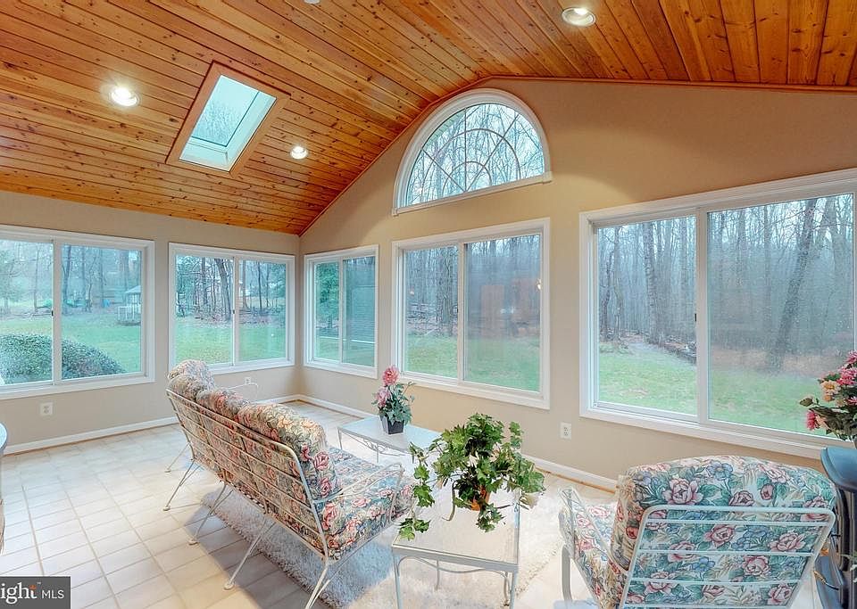 Gorgeous sun room looking to the back yard
