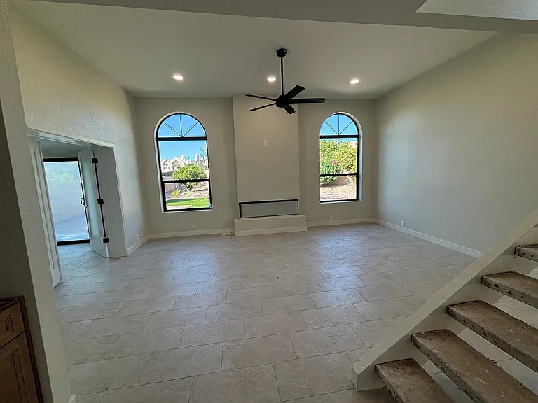 Living Room with Fireplace. Brand new windows throughout home
