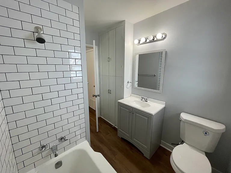 Bathroom with floor-to-ceiling storage.