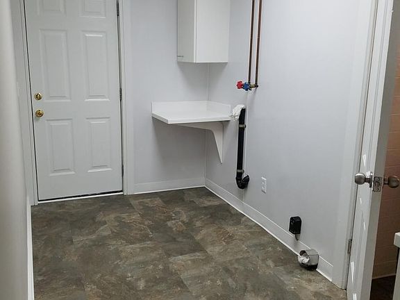 Back hall with washer & dry hook up.