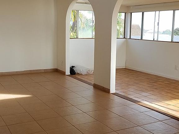 Upstairs living room/ enclosed patio