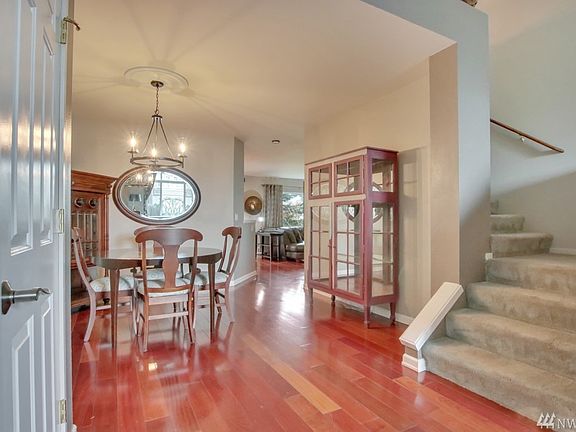 Hardwood floors and vaulted entry way