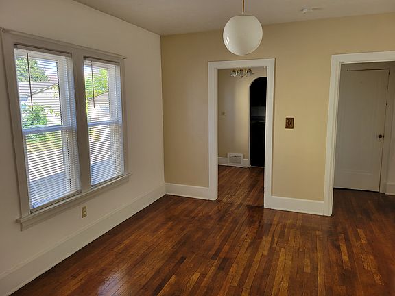 Dining room leading to breakfast nook and hallway to bathroom and bedrooms and new windows.