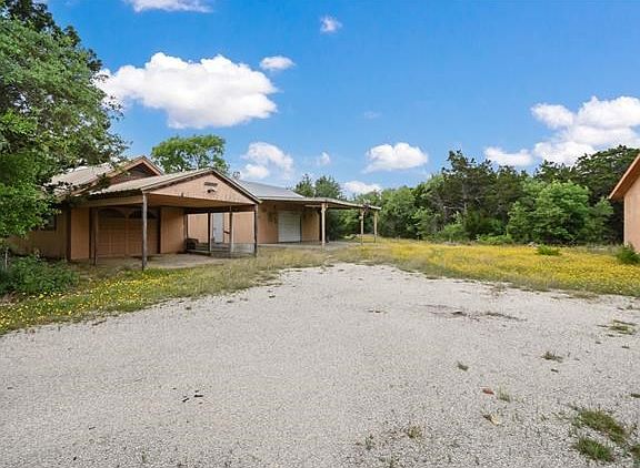 These two garages are in need of repair.  Both are on a slab.