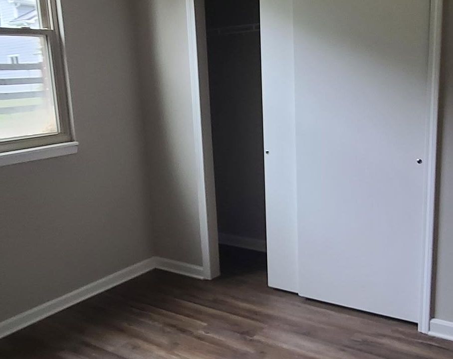 large closet in guest bedroom. Runs wall to wall