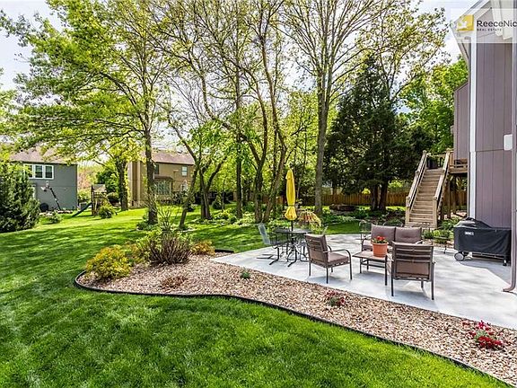 Grill up some fun in this Out-doorable yard with over-sized patio and deck