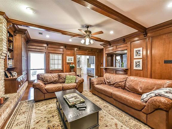 Expansive den offers easy access to the backyard and pool.