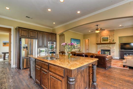 Stainless steel appliances, including double ovens make this space functional.