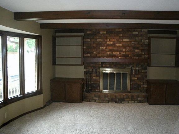 Living Room with Brick Fireplace