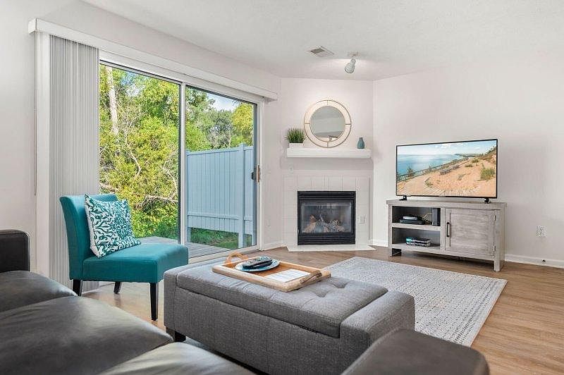 Living Room with 8" Patio Door, Fireplace, and 50" Television