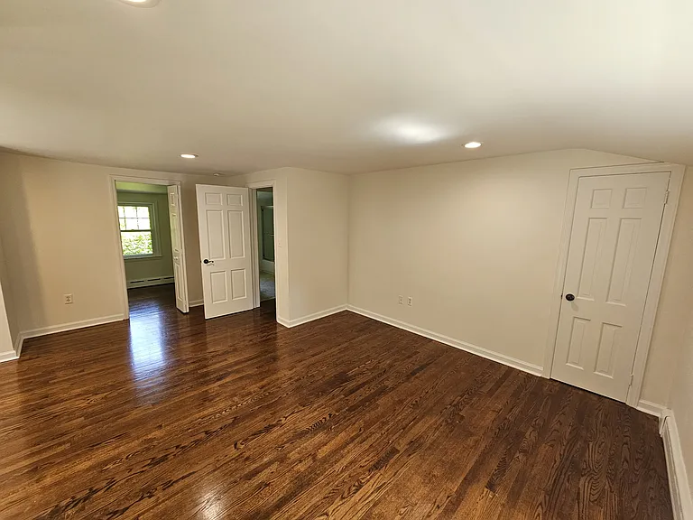 1st Floor Bedroom 2 _ View 2
Additional view showing the hardwood floors, recessed lighting, flexible layout, and walk-in closet entrance.