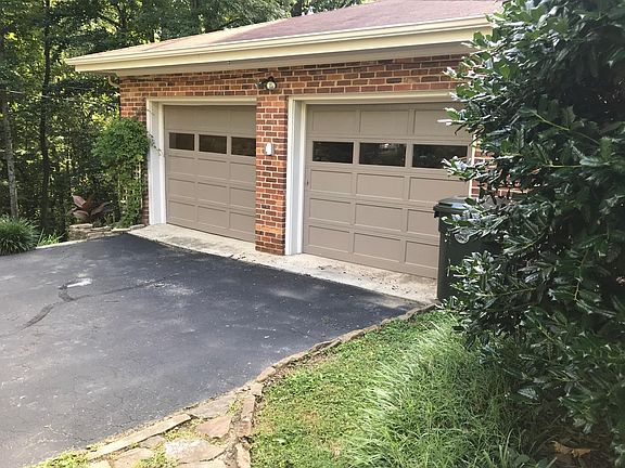 Double car garage with door openers and utility sink.