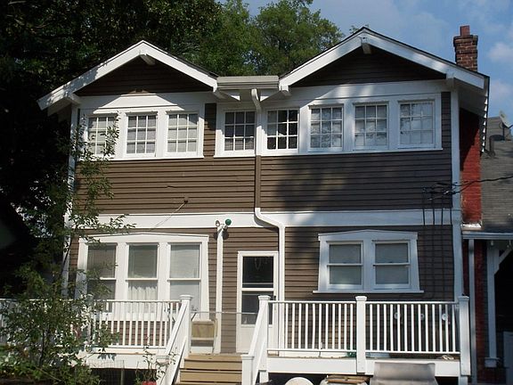 Rear view of house and upstair kitchen and bedroom windows