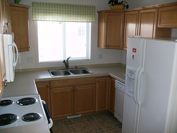 This kitchen has maple cabinets, drawers in the cupboard & lazy susan's!