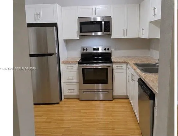 5401 SW 77th Ct #202E — Photo 1