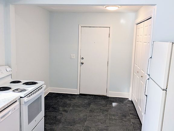Kitchen area. Rear door to back porch and back deck. Washer and dryer are located in the closet.