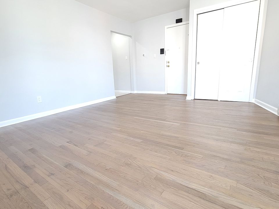 Large light filled living room with closet