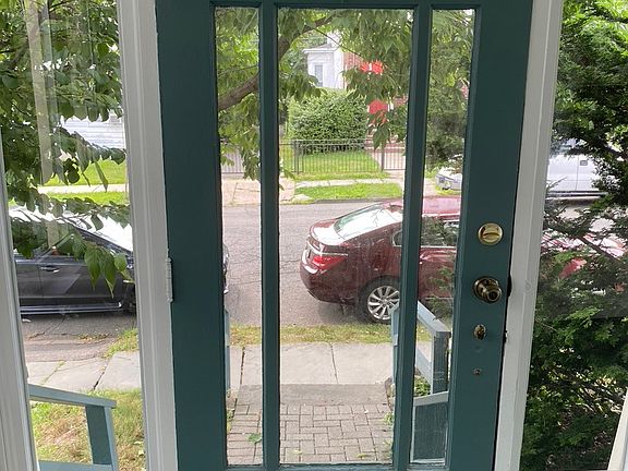 Looking out from front door- lovely neighborhood near park and 3 min walk to train