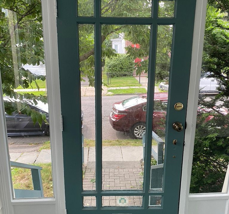 Looking out from front door- lovely neighborhood near park and 3 min walk to train