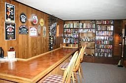 Custom Bar Overlooking Fireplace and Views From Large Window 