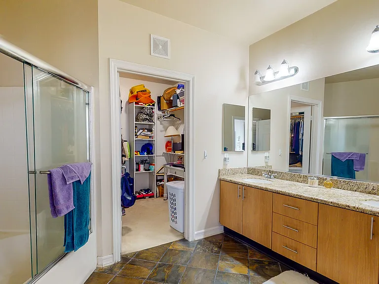 view from the main bedroom of the en suite bathroom and walk-in closet