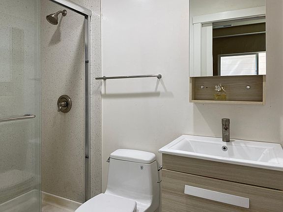 The room for rent is downstairs with en-suite bathroom.