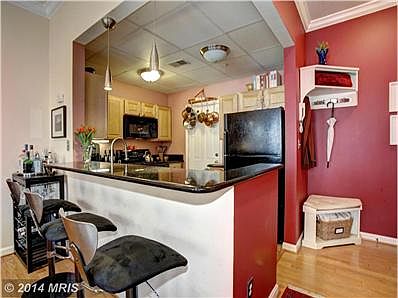 Kitchen opens to main living space w/ seating