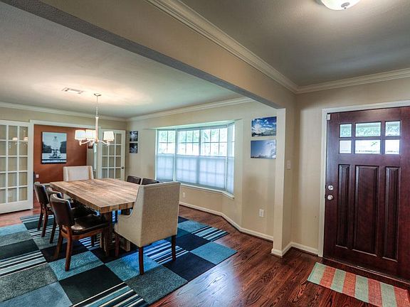 At the front of the house is a very large dining room highlighted by three great windows.