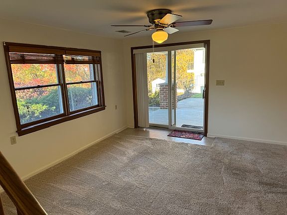 Living room with access to side patio