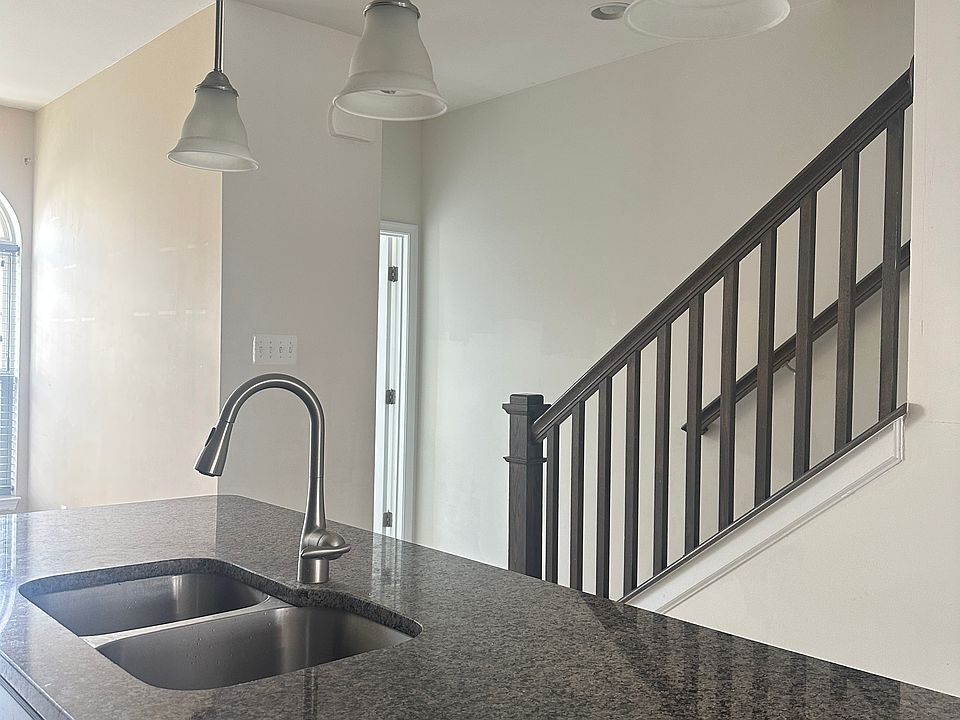 Large island, drop lights and double sink