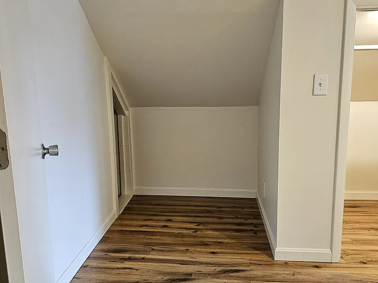 A little nook in the South Bedroom. Good spot for more storage and to create a cute reading nook!