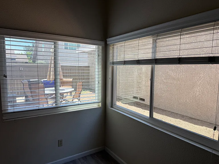 View of back patio from open living space area on the first floor.