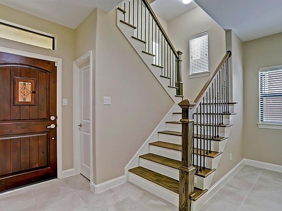 Beautiful entry way staircase leading to the second floor
