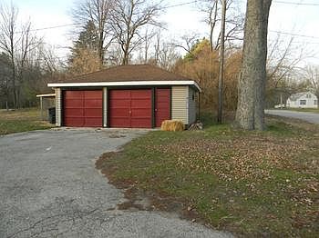 Detached garage is 2.5 car.  Dog pen attached stays with the house.  