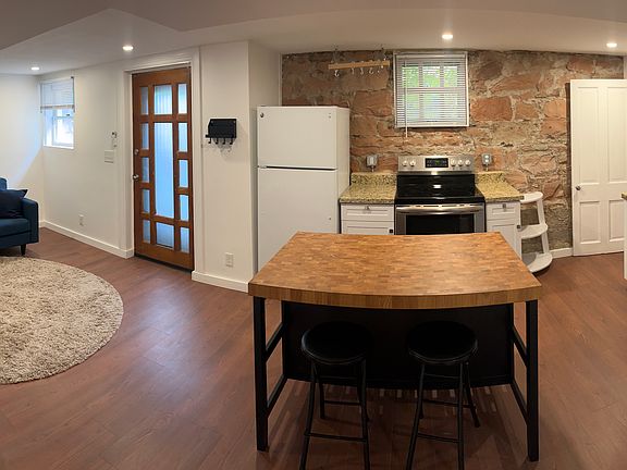Living room/kitchen. Door to the exterior is in the living room
