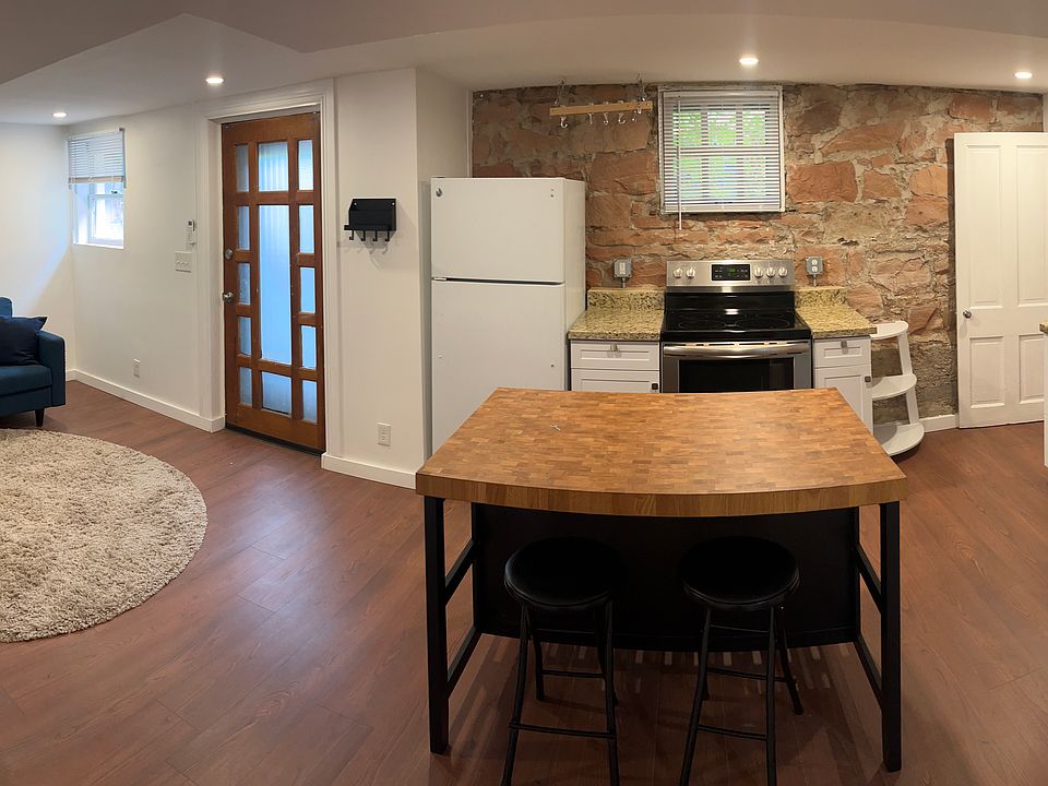 Living room/kitchen. Door to the exterior is in the living room