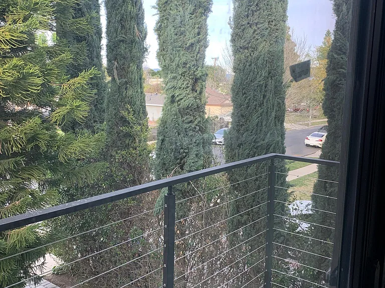 modern balcony overlooking quiet street