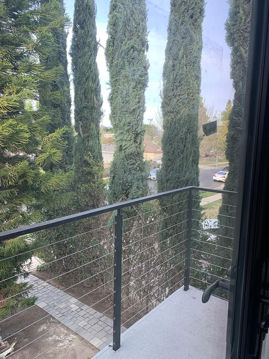 modern balcony overlooking quiet street - 20342 Lorne St