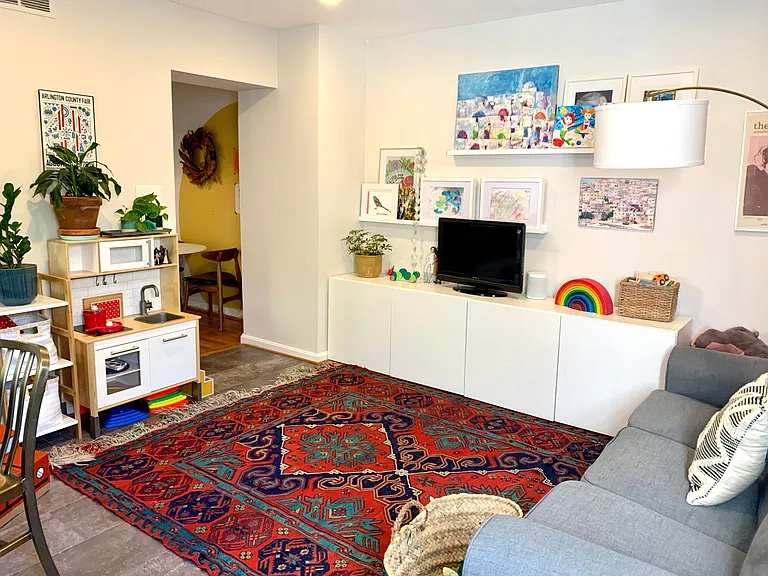Sitting area doubles as a upstairs play area. Console holds games and toys with small pieces.