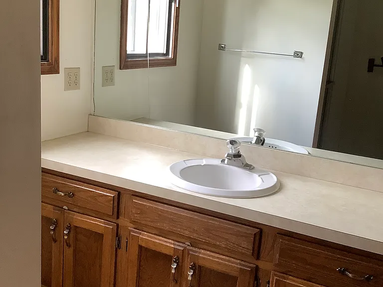 Both upstairs bathrooms have large vanities