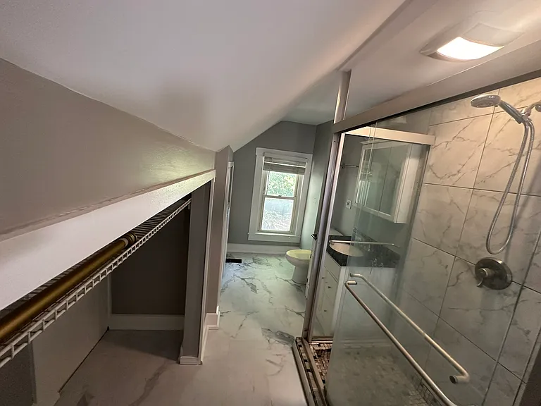 Bathroom with closet and included washer and dryer